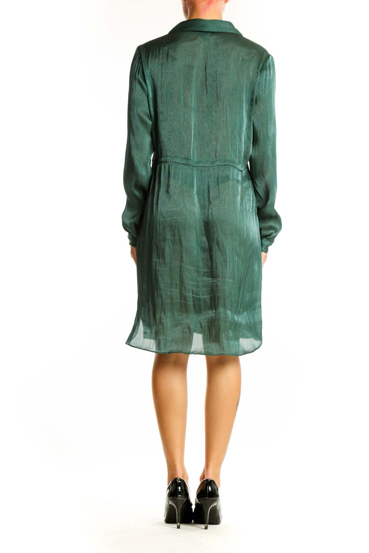 Side view of green sheer Alfani shirt dress showing flowy silhouette