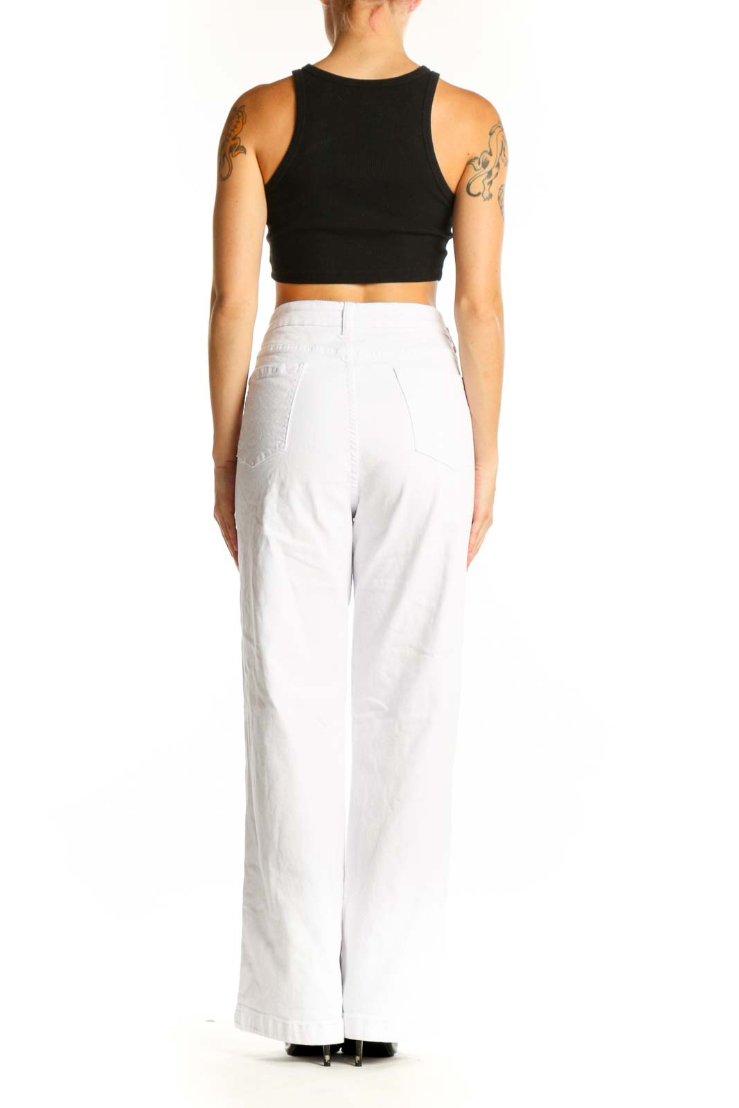 Side view of model wearing white wide-leg denim trousers from SilkRoll