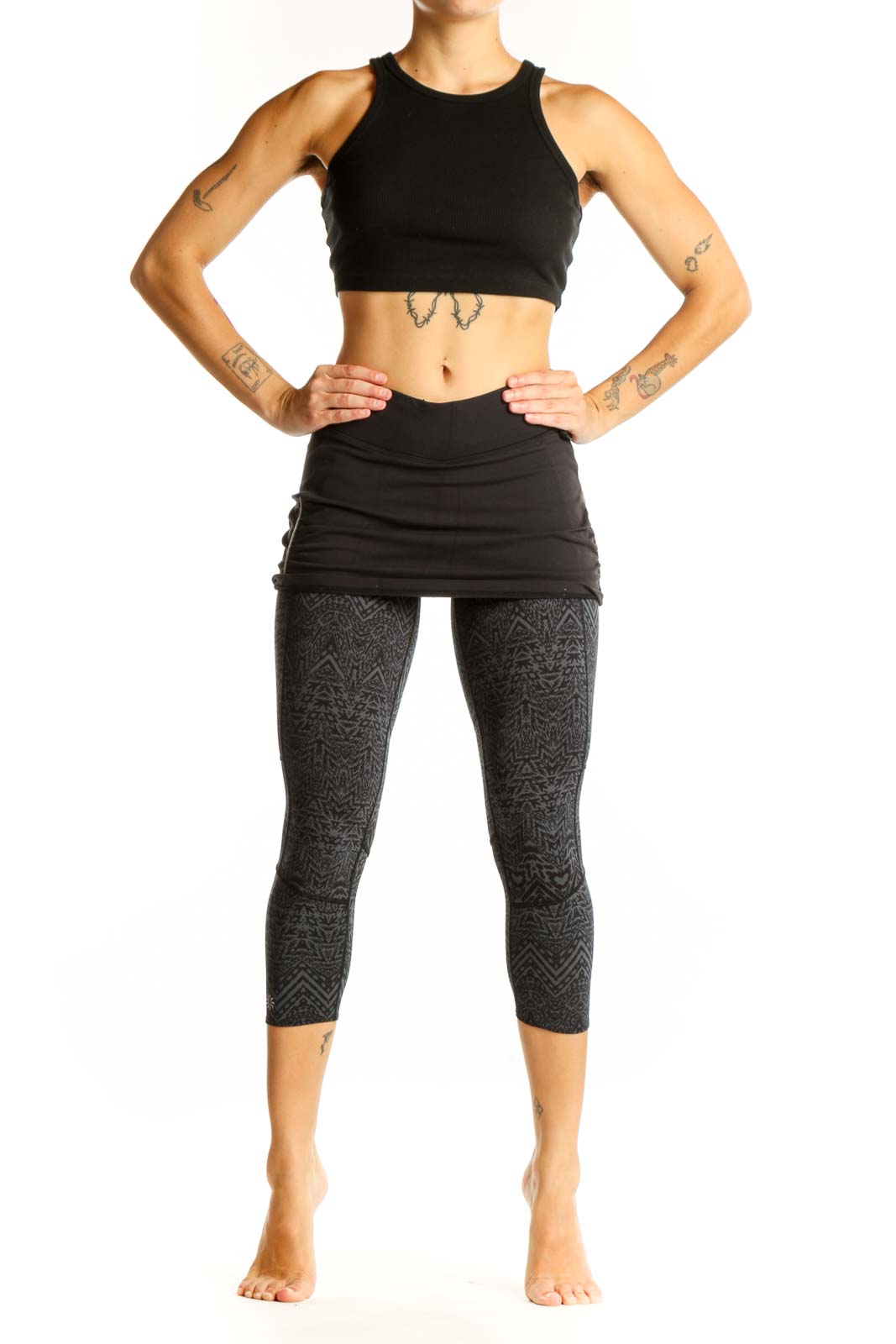 Front view of Athleta black patterned capri leggings with attached skirt