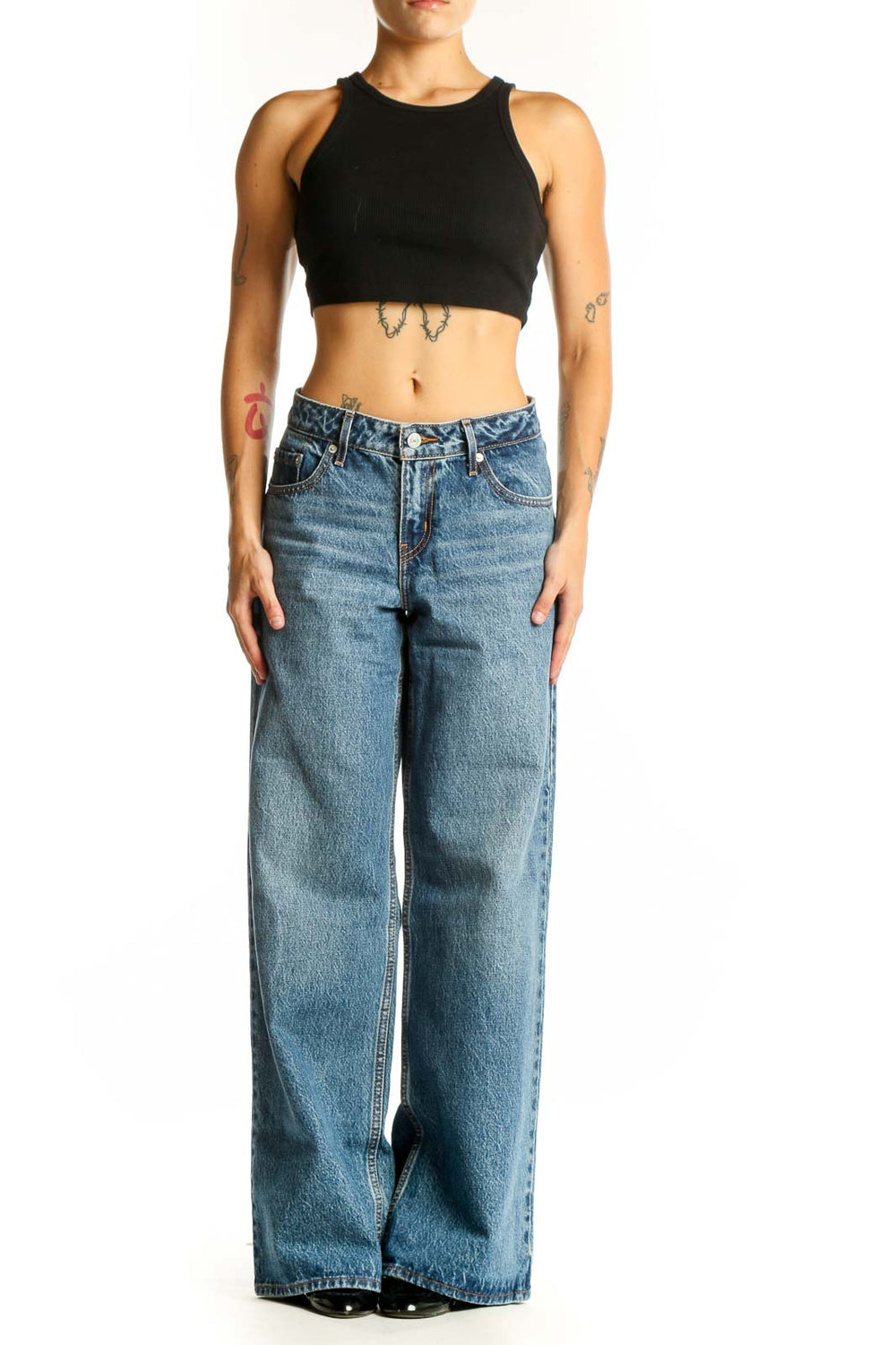 Front view of blue wide-leg Levi's jeans on model