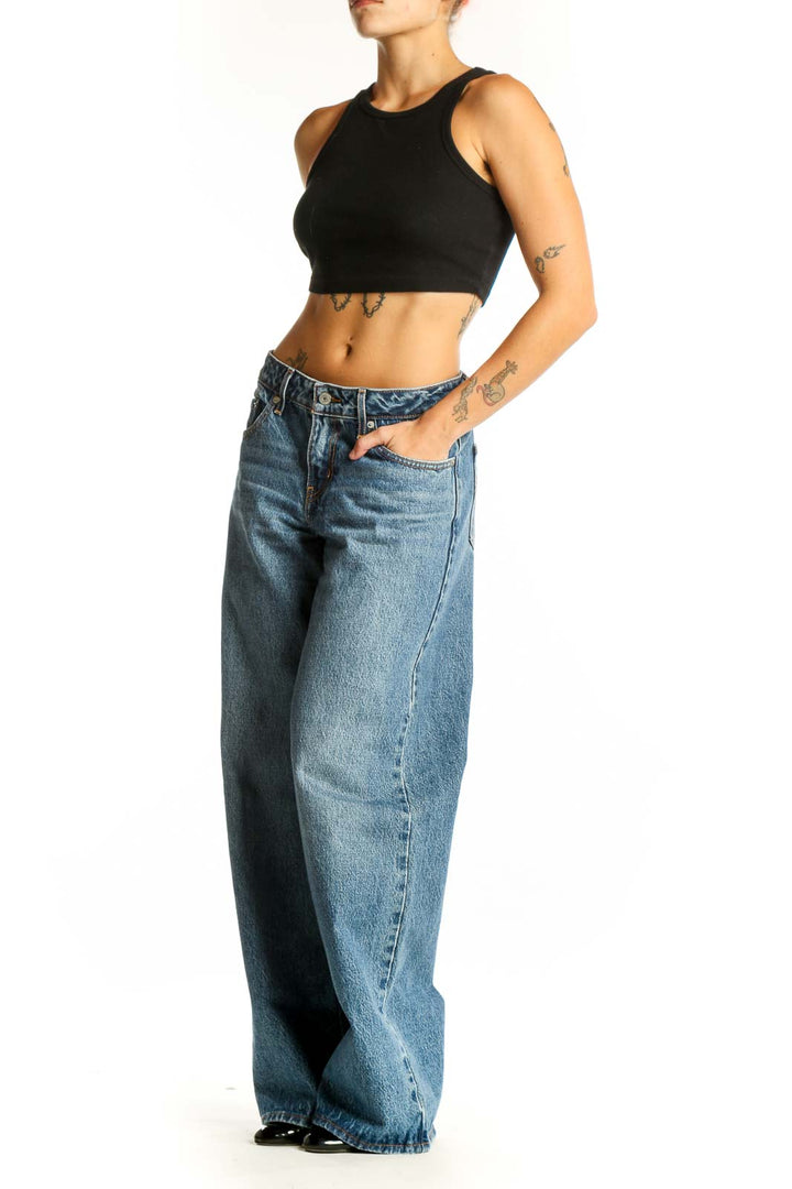 Front view of blue wide-leg Levi's jeans on model