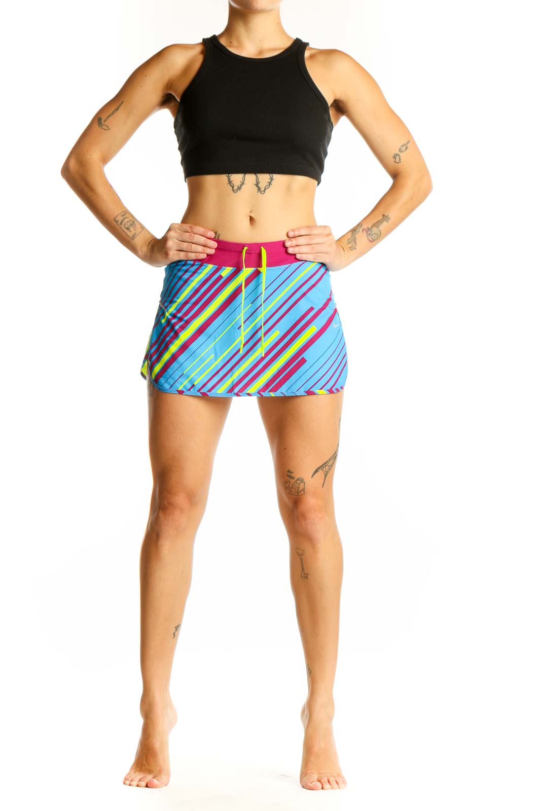Front view of blue Nike athletic skort with pink and yellow stripes