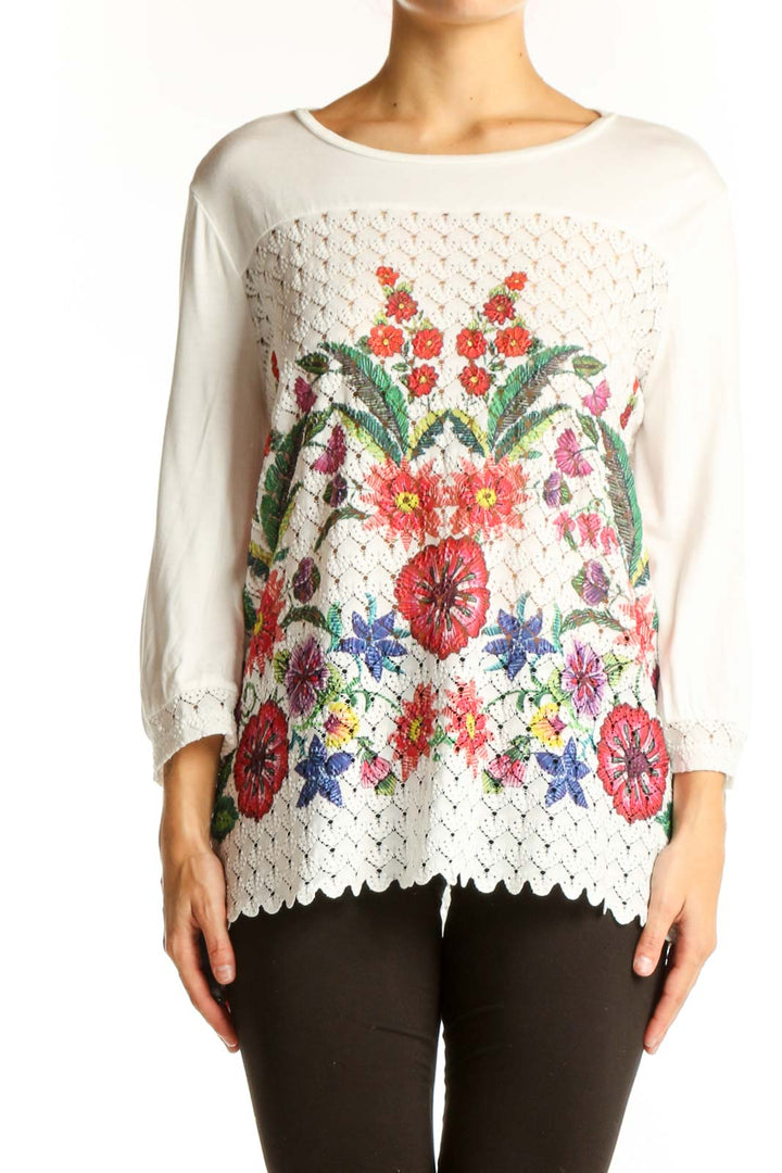 Front view of Desigual white lace top with colorful floral embroidery