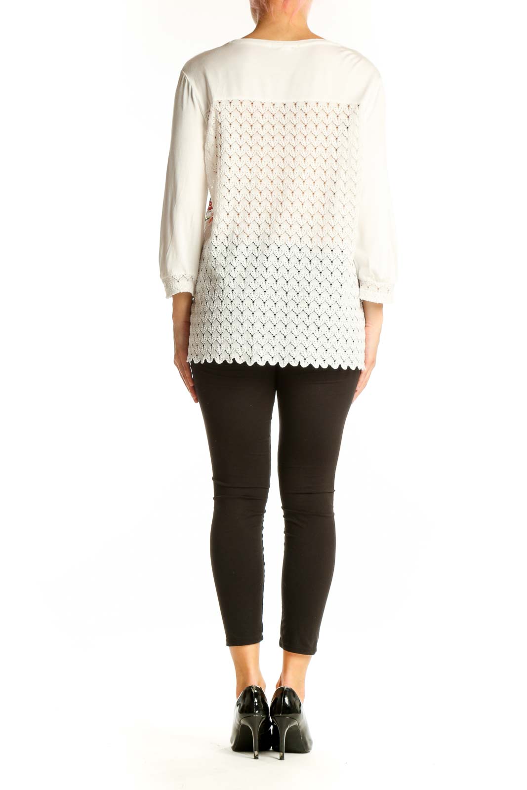 Side view of Desigual white lace top showing floral embroidery detail