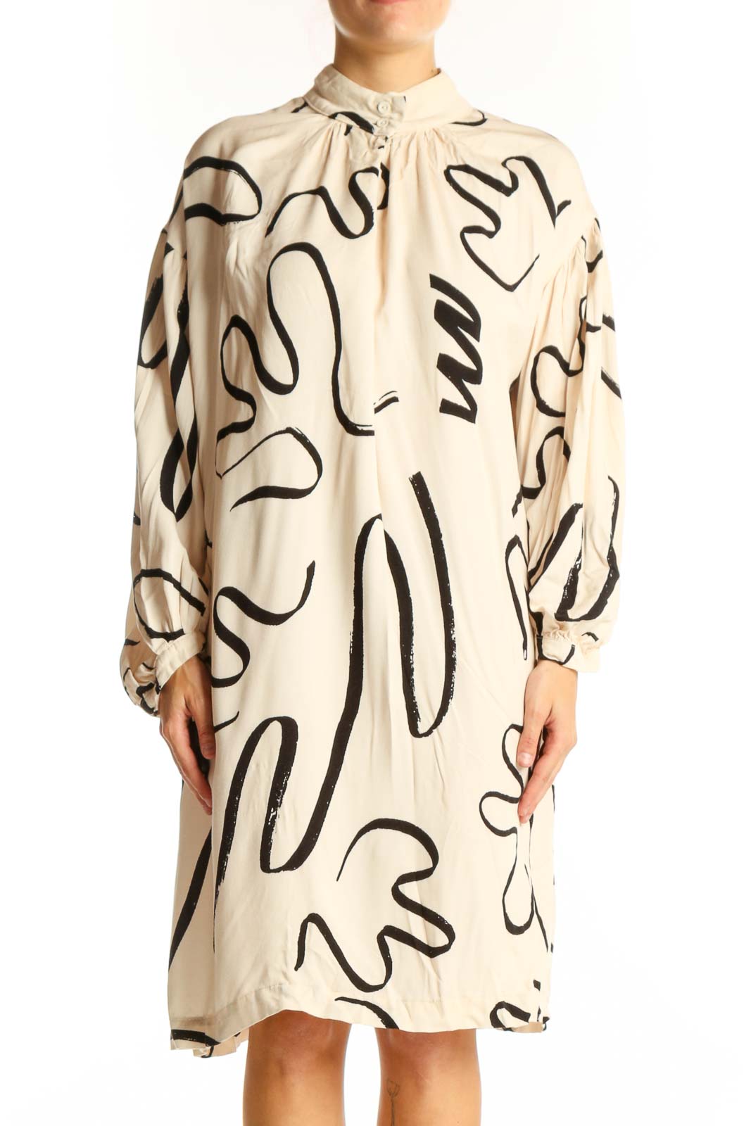Front view of Eve Gravel beige viscose dress with black abstract pattern