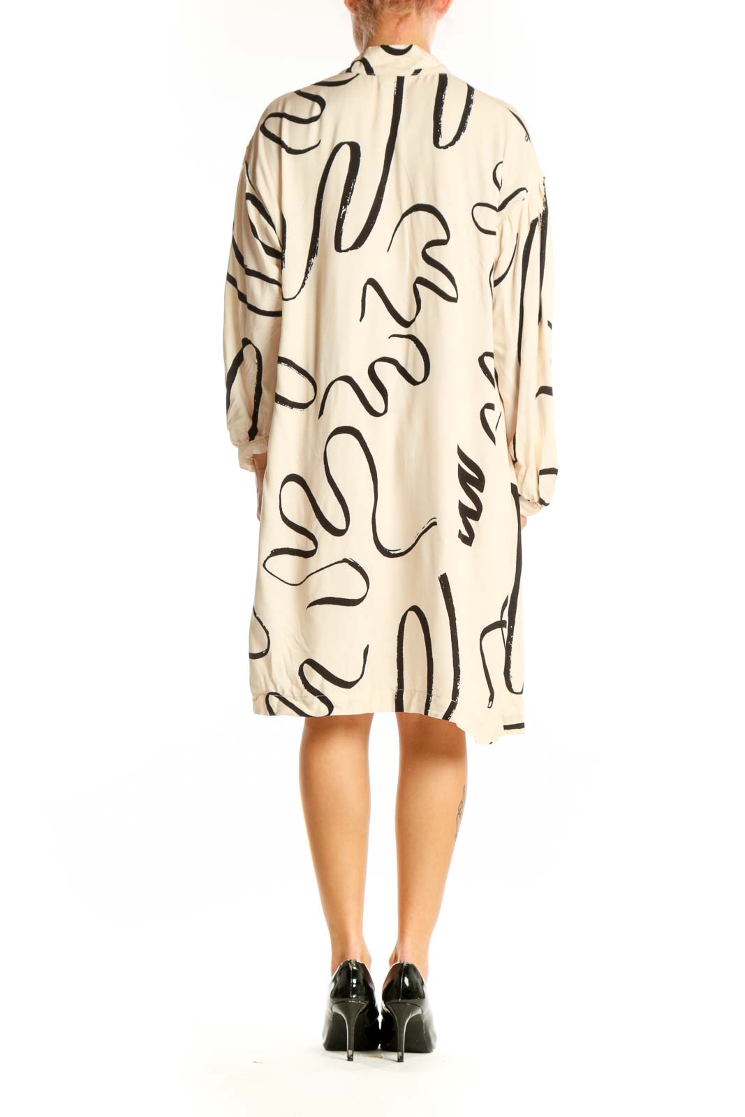Back view of Eve Gravel beige viscose dress showing flowing silhouette