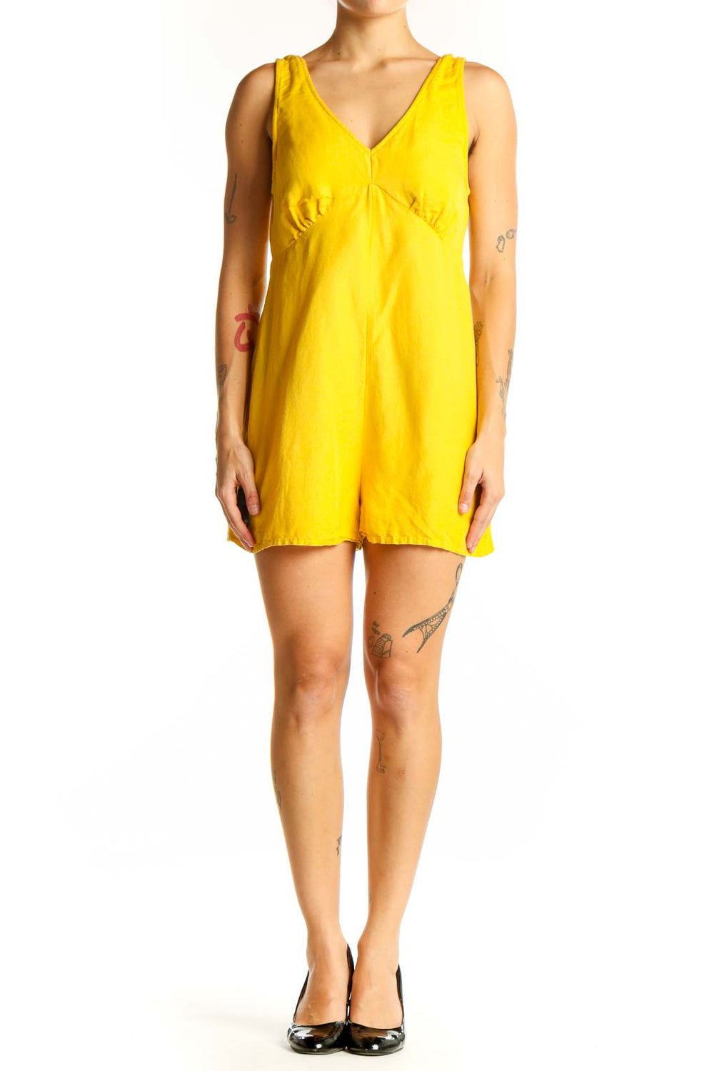 Front view of yellow RVCA V-neck sleeveless romper