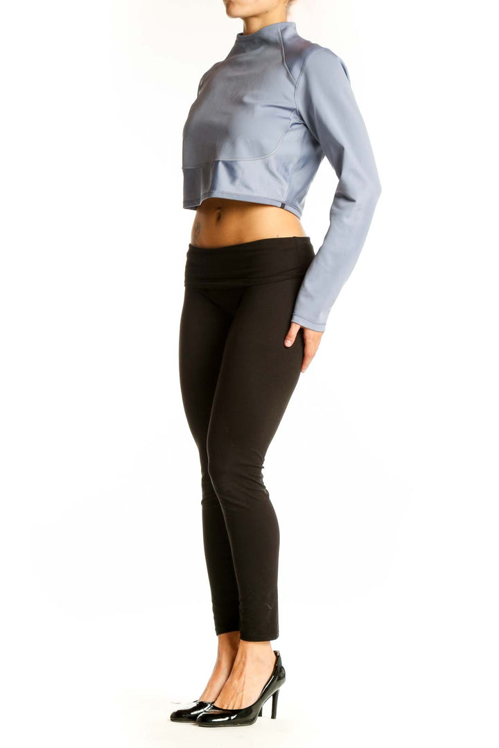 Front view of Nike Light Blue Cropped Athletic Top with high neck