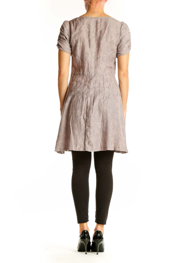 Back view of taupe Kimchi Blue pleated short sleeve dress
