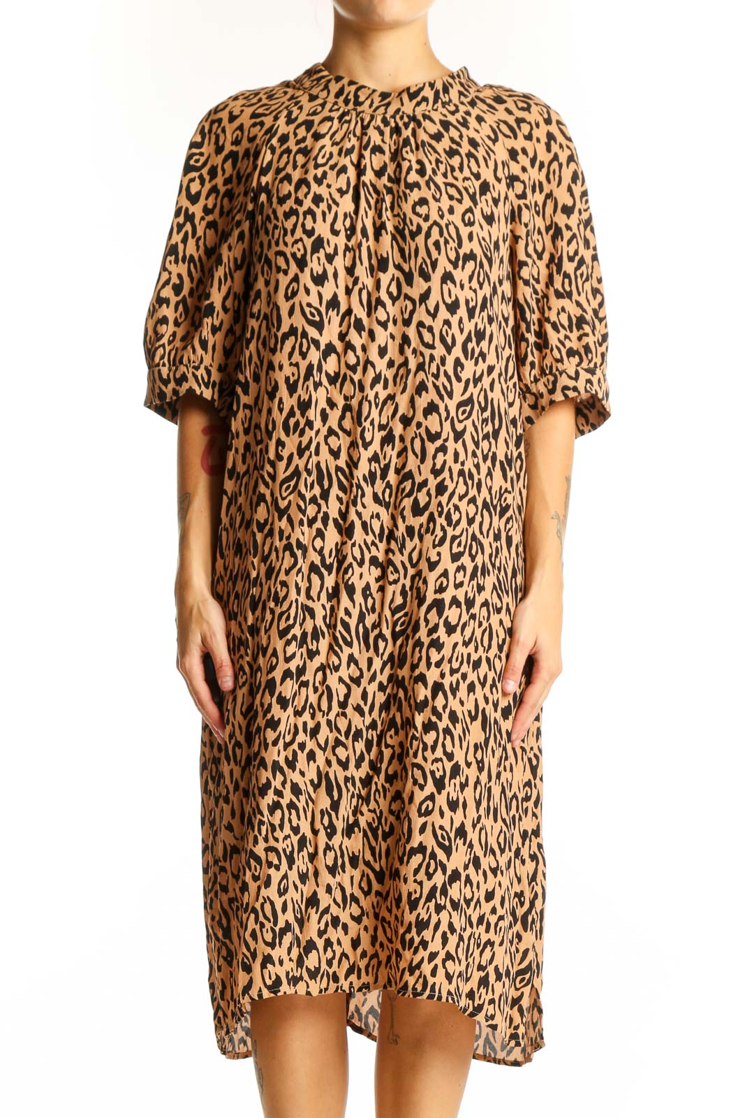 Front view of tan leopard print midi dress from Anthropologie