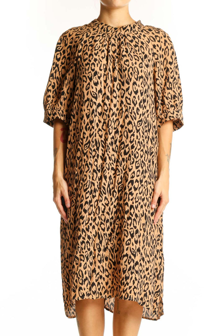 Front view of tan leopard print midi dress from Anthropologie