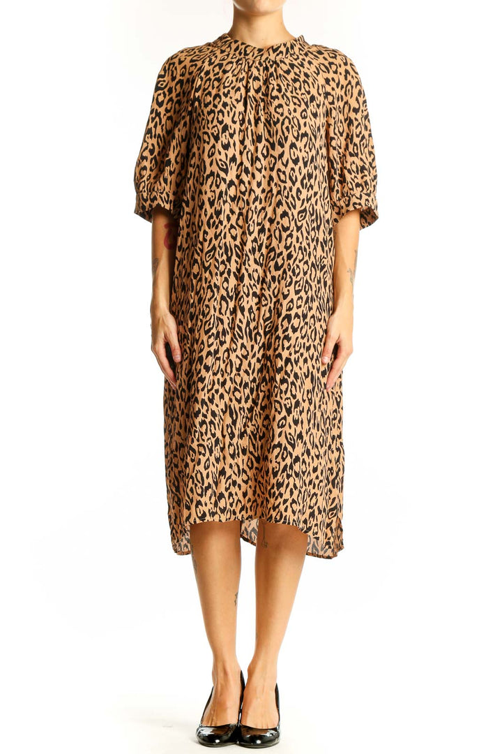 Front view of tan leopard print midi dress from Anthropologie