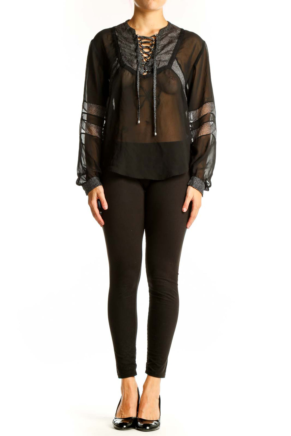 Front view of black sheer lace-up blouse by The Kooples