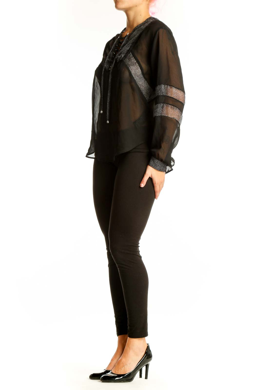 Front view of black sheer lace-up blouse by The Kooples