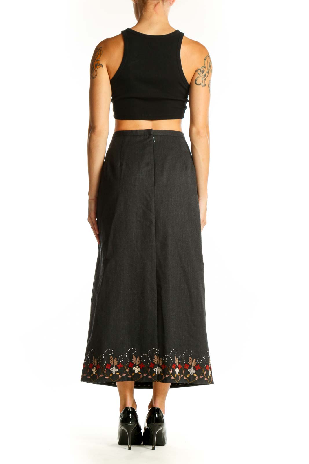 Side view of model wearing Pendleton charcoal wool maxi skirt with black top
