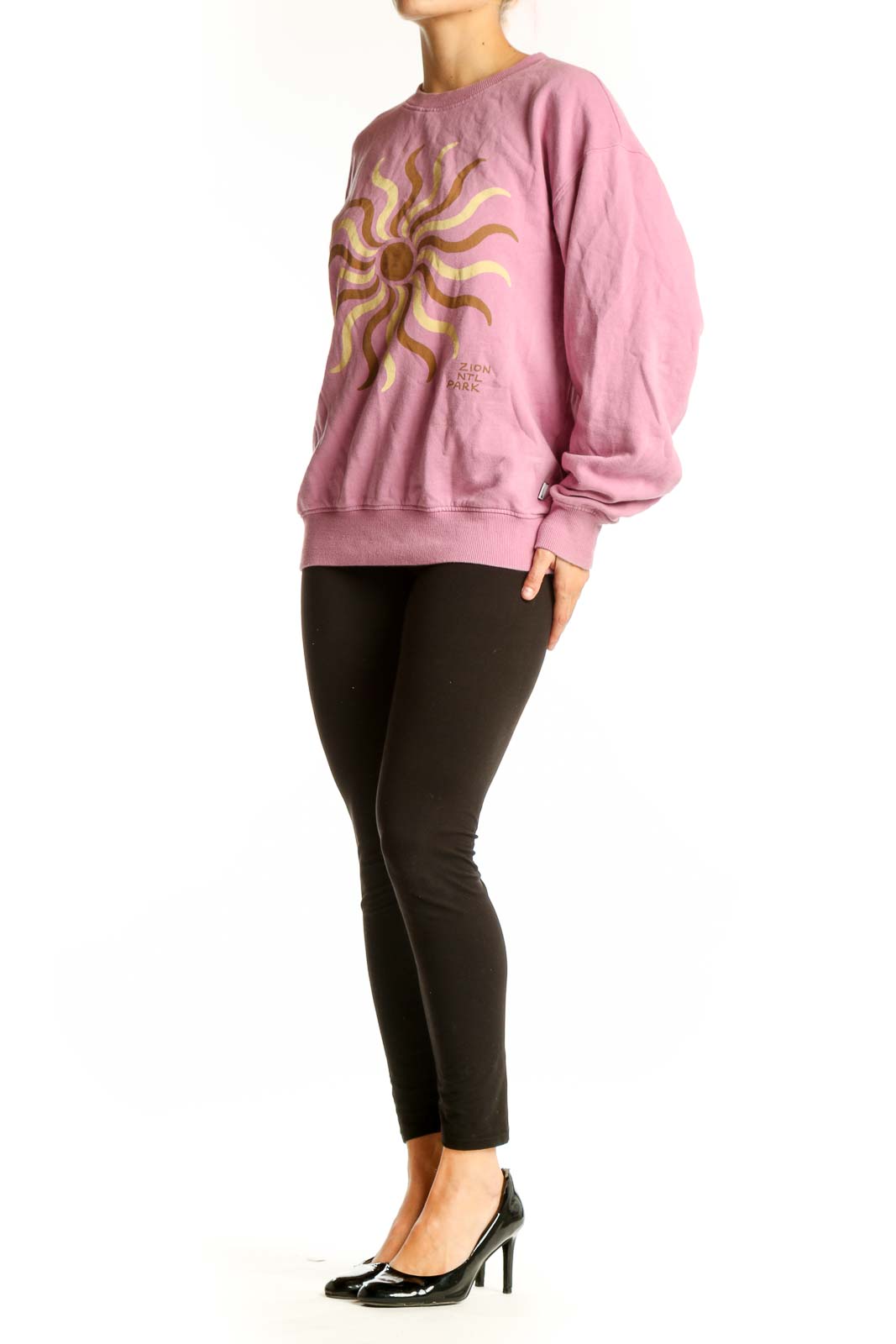 Front view of Madewell pink sweatshirt with golden sun graphic