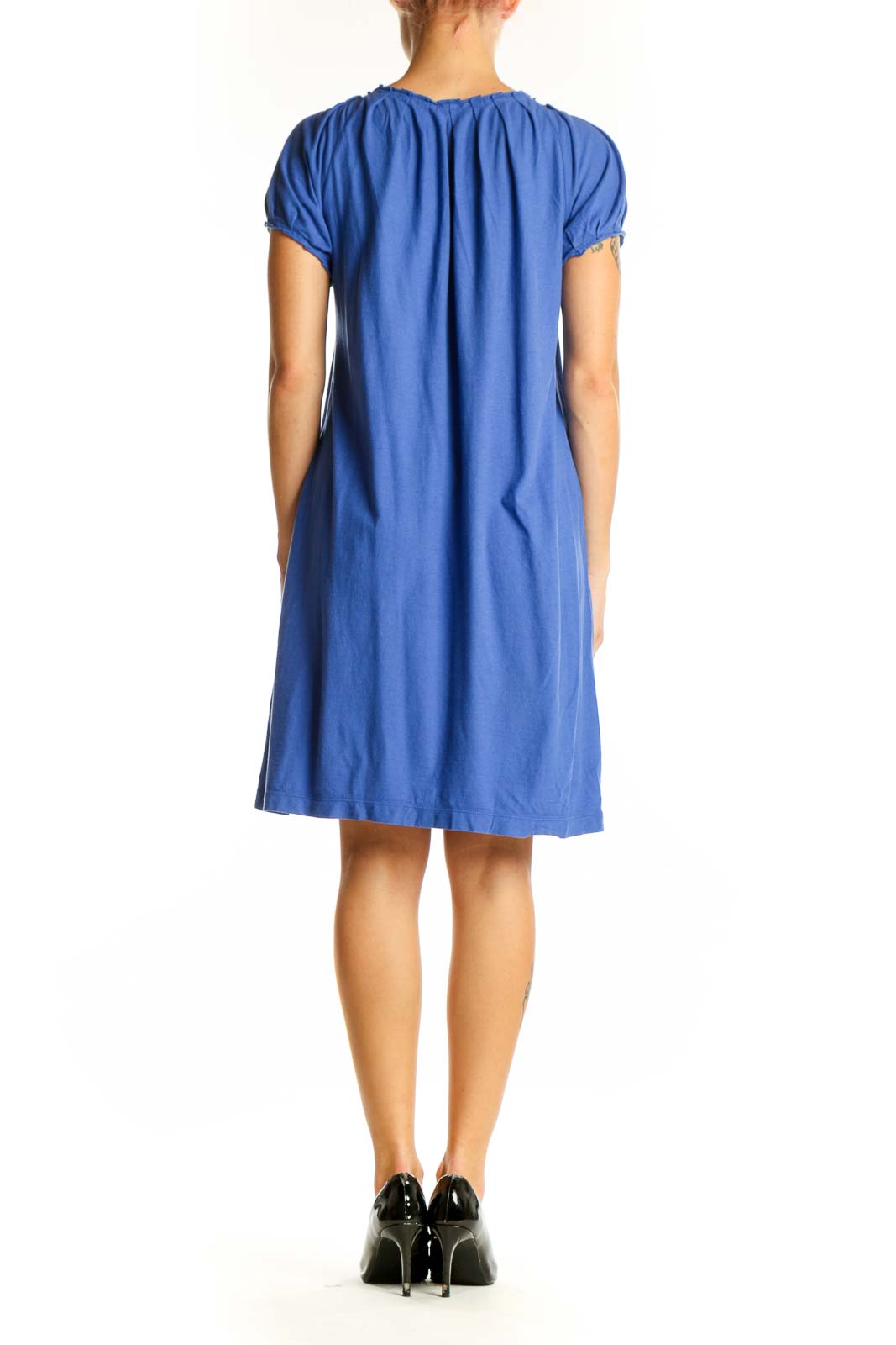 Side view of J.Crew blue flowy tunic top showing drape and length