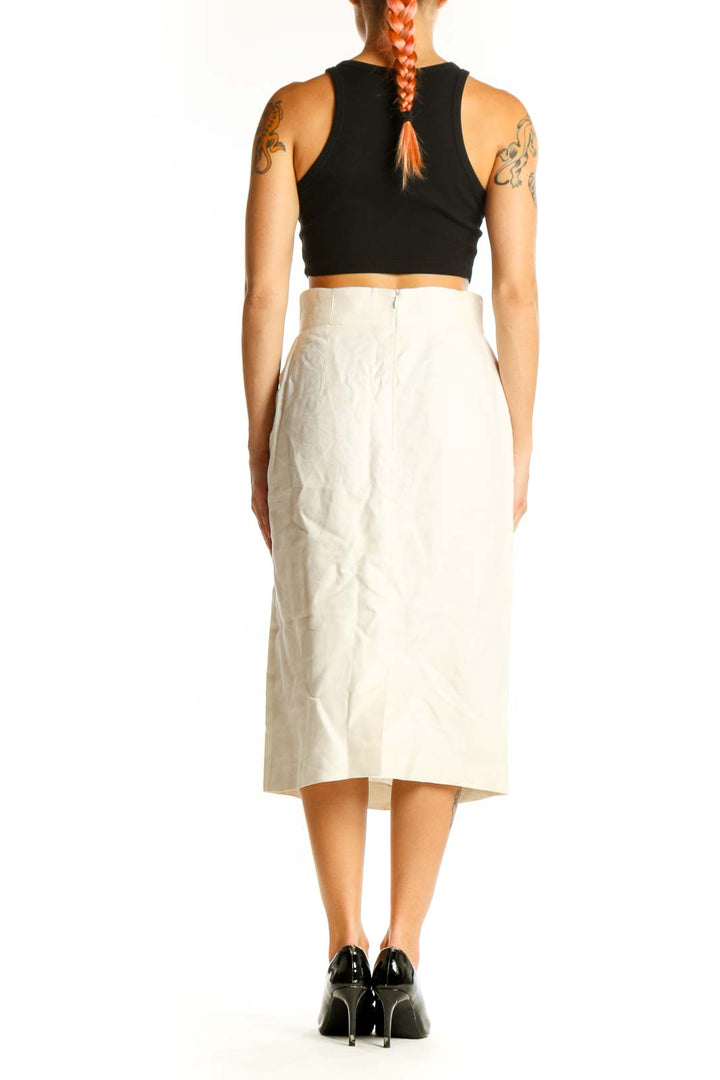 Side view of white high-waisted cotton midi skirt by ESCADA with black top