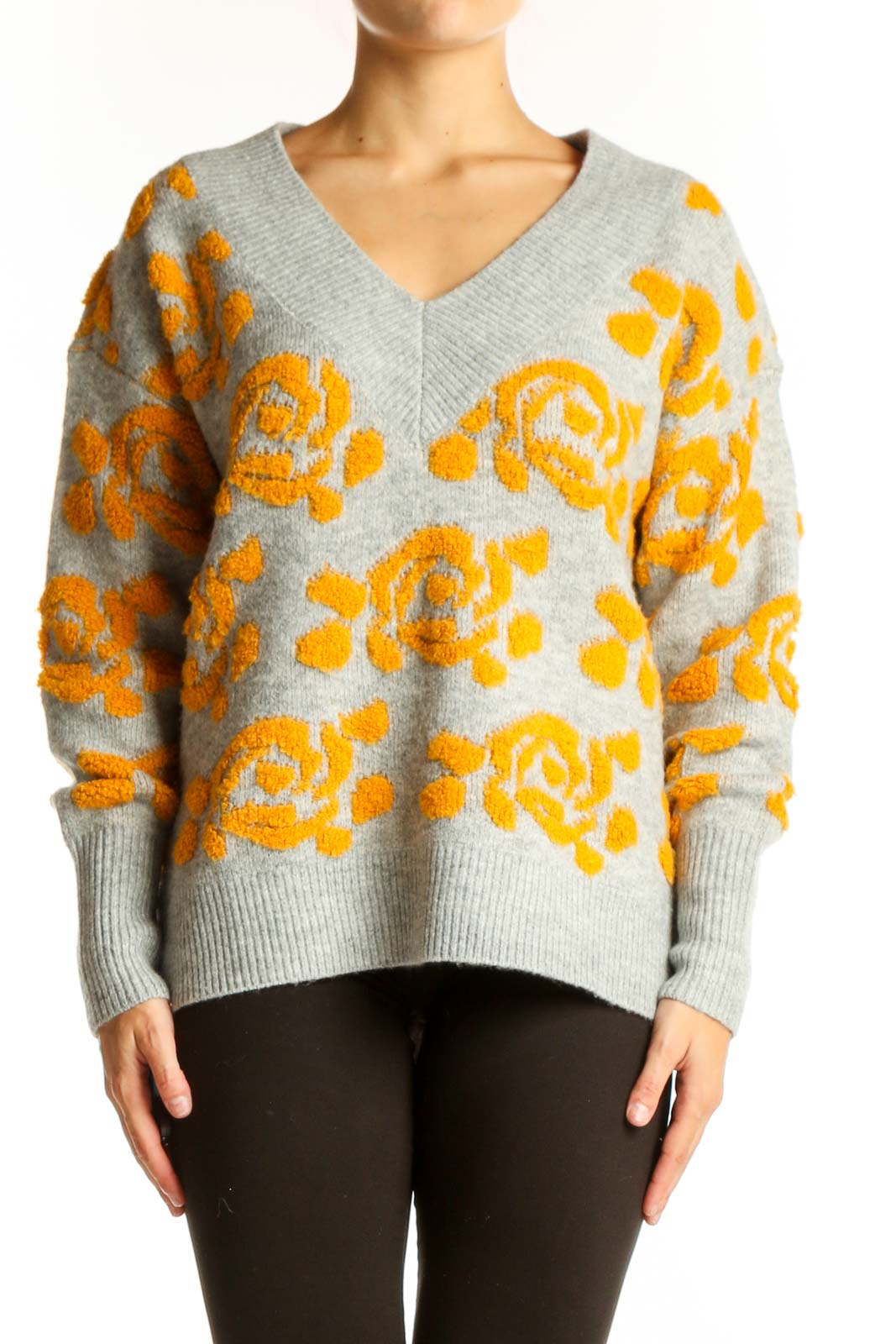 Front view of gray V-neck sweater with yellow floral pattern