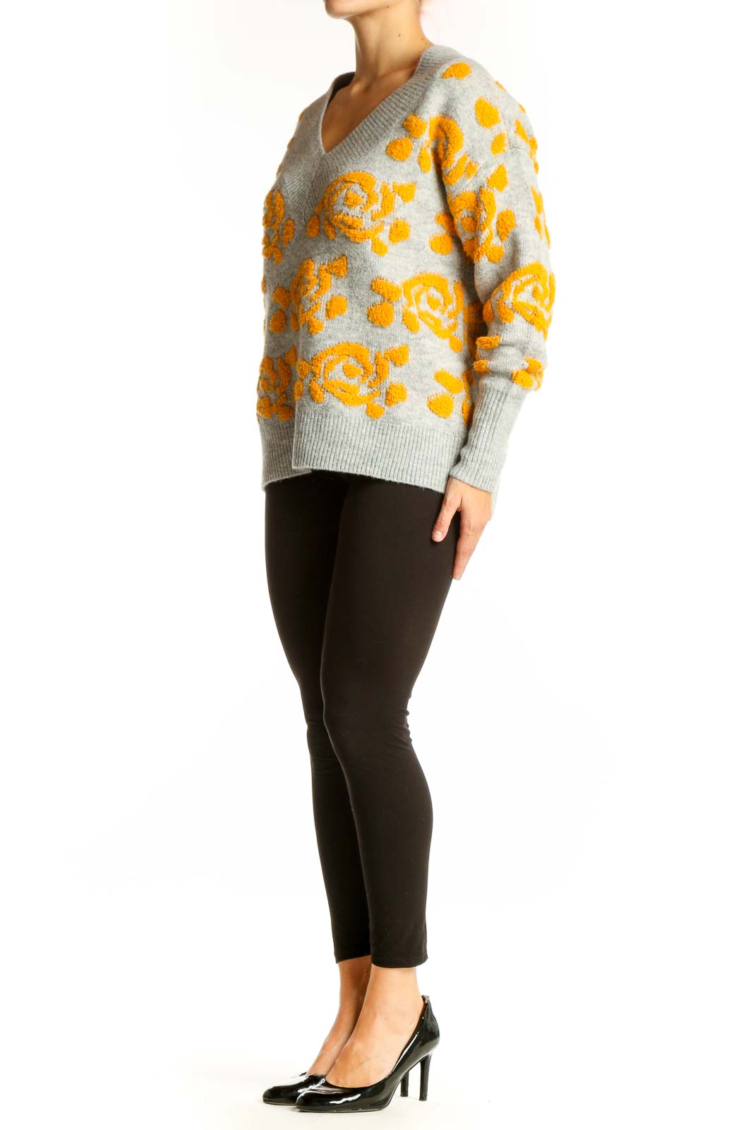 Front view of gray V-neck sweater with yellow floral pattern