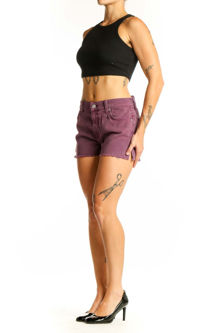 Front view of purple denim cut-off shorts by 7 For All Mankind