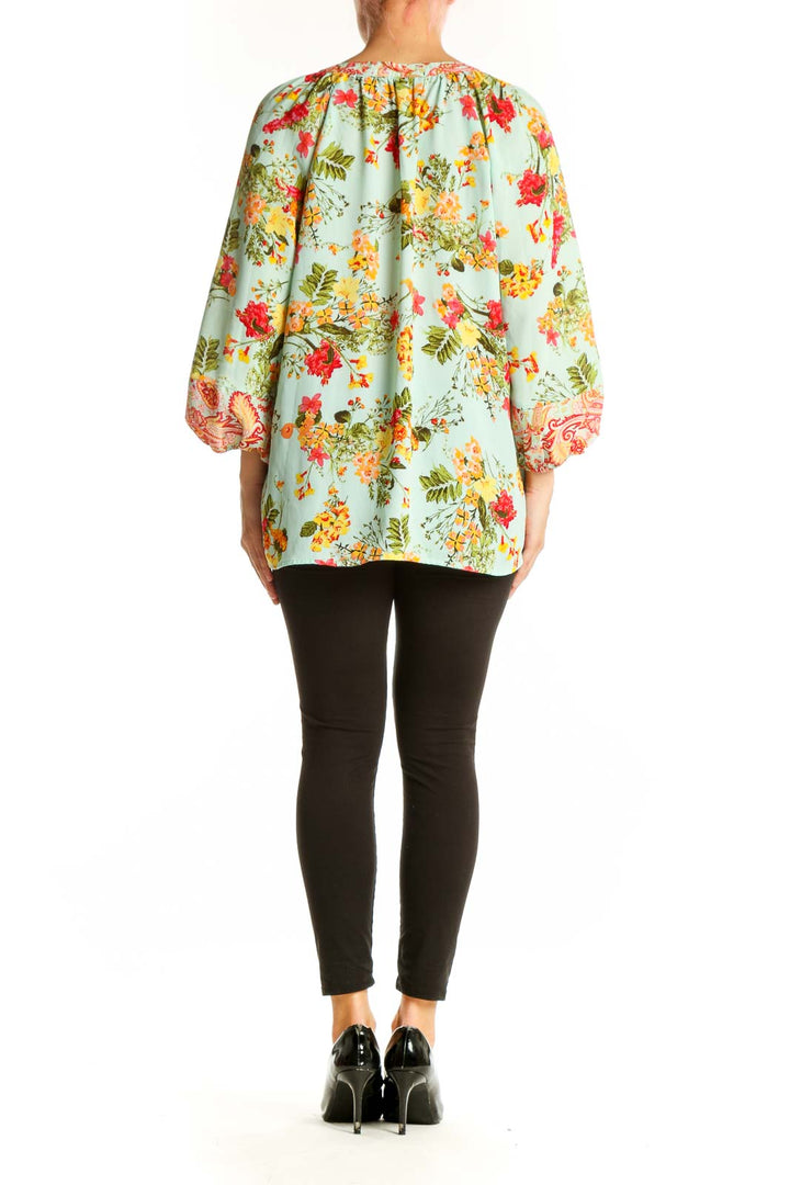 Side view of Olive Hill mint floral paisley blouse showing flowing silhouette