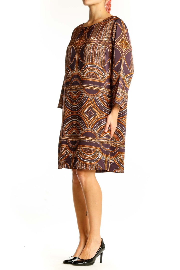 Front view of The Limited brown geometric print shift dress with boat neckline and three-quarter sleeves