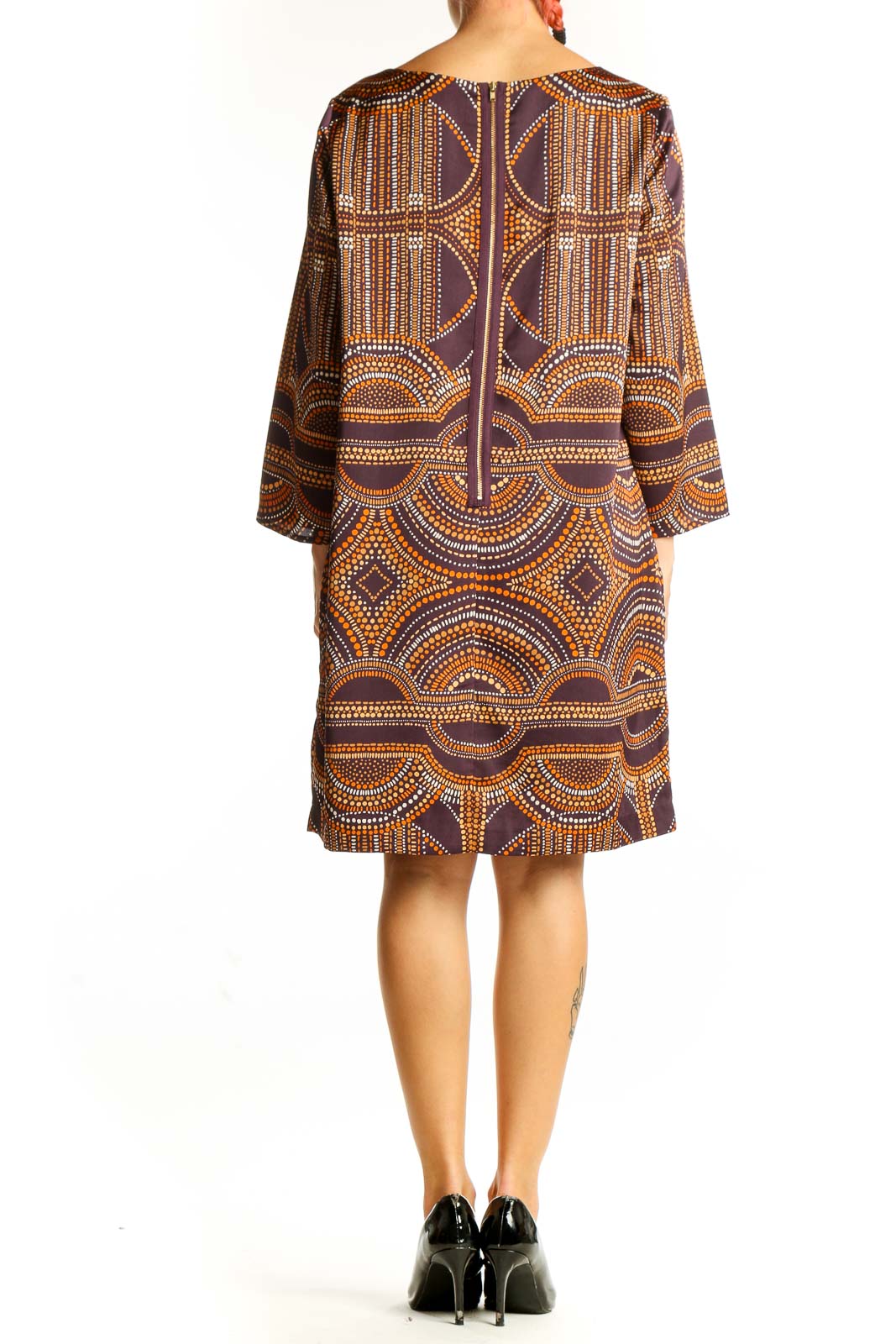 Side view of The Limited brown geometric print shift dress showing the knee-length hem and relaxed fit