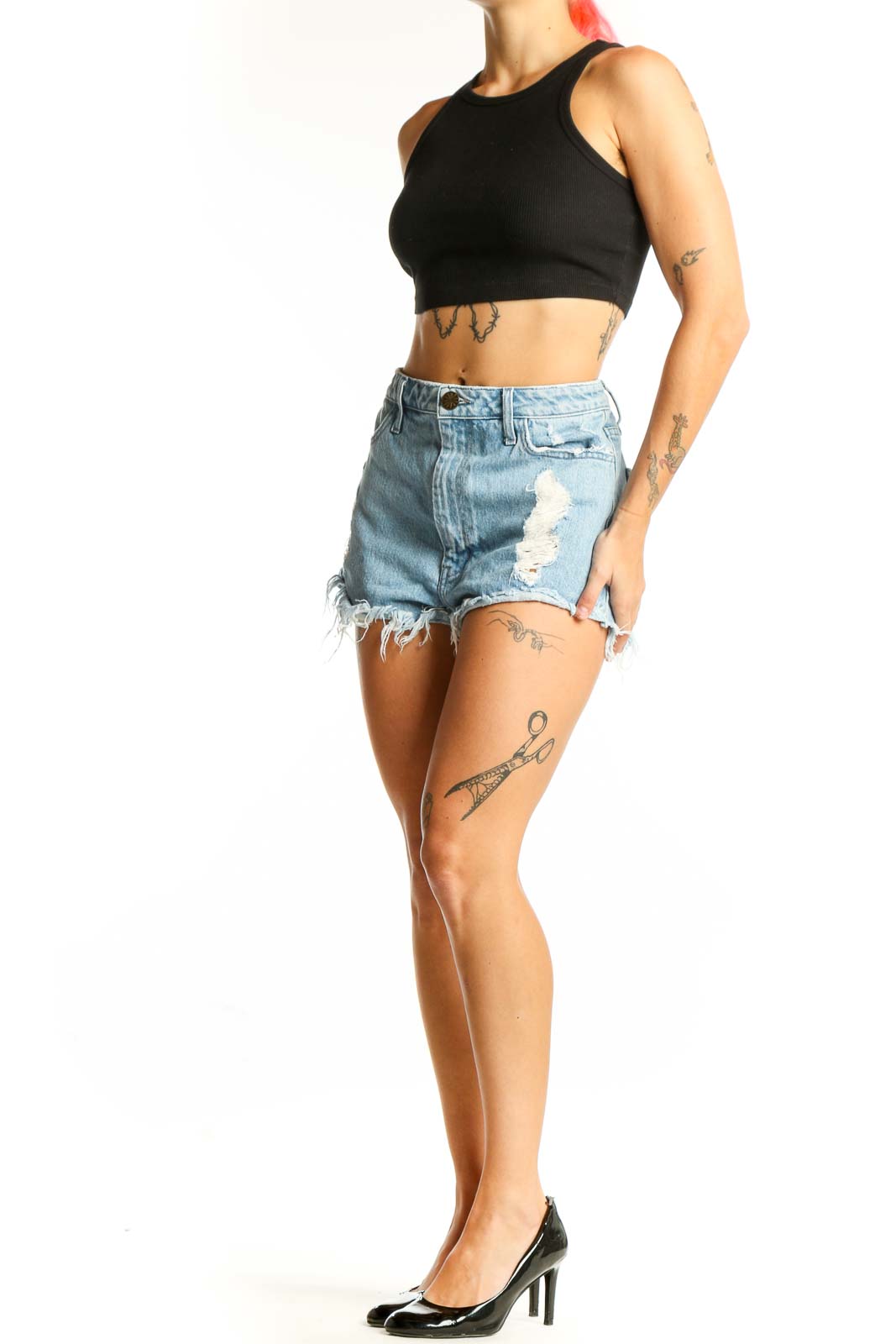 Front view of Mumu light blue distressed denim shorts with frayed hem