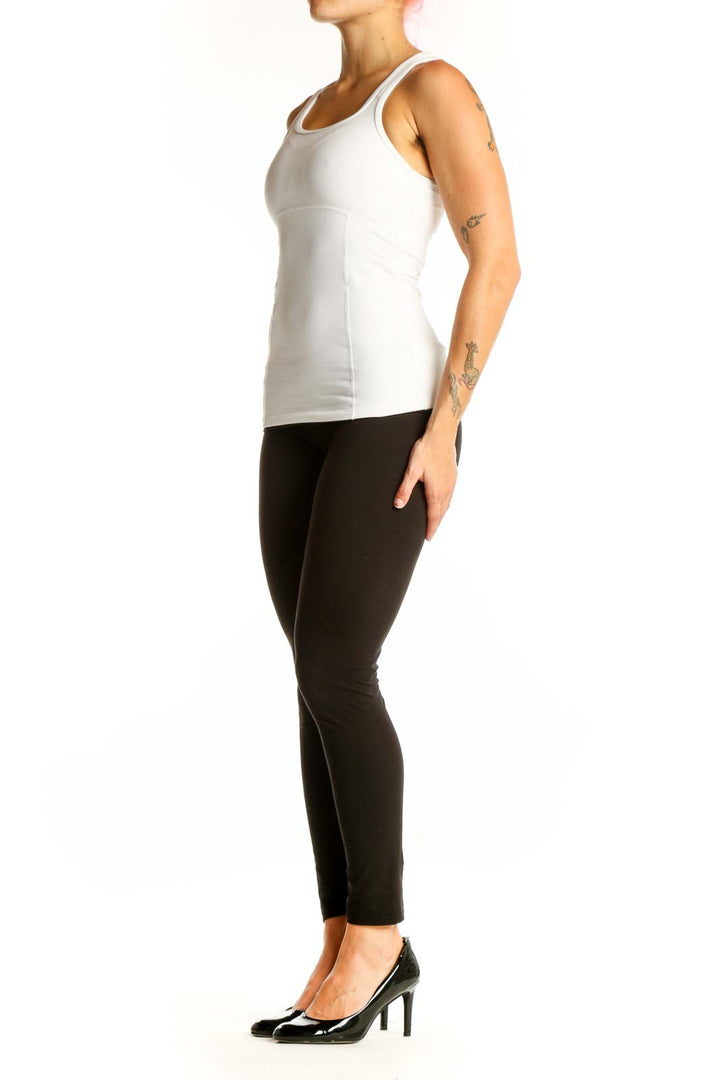 Front view of white Athleta athletic tank top on model