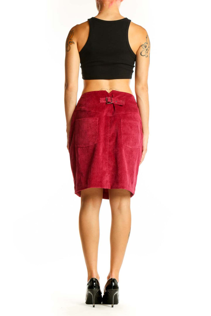 Side view of Rebecca Minkoff red corduroy A-line skirt on model with black top
