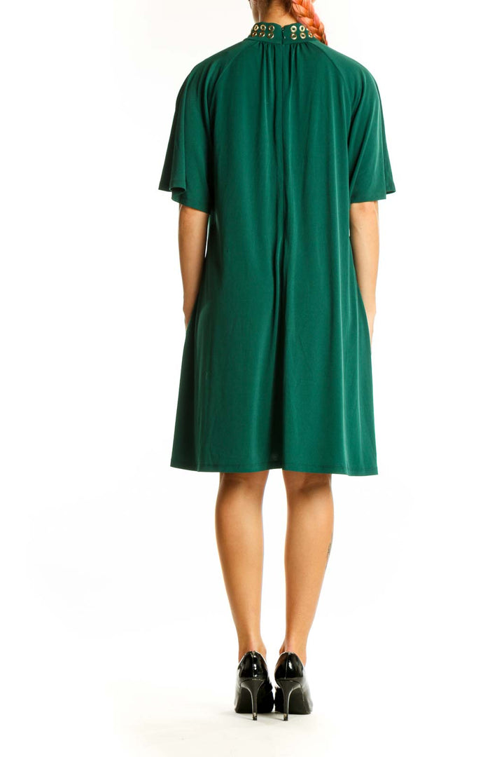 Back view of green Michael Kors cocktail dress showing fluttery sleeves
