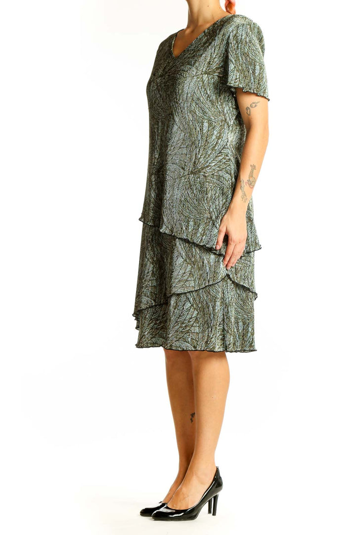 Front view of Connected Apparel green floral tiered midi dress with V-neckline
