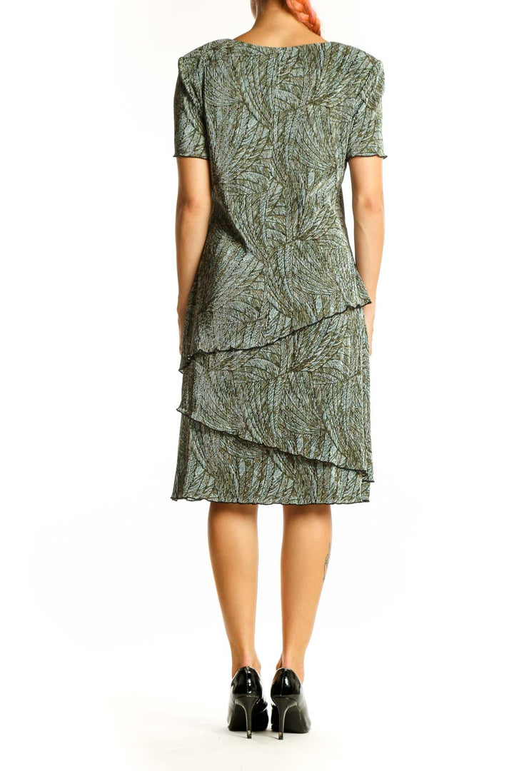 Side view of Connected Apparel green floral tiered midi dress showing flutter sleeves
