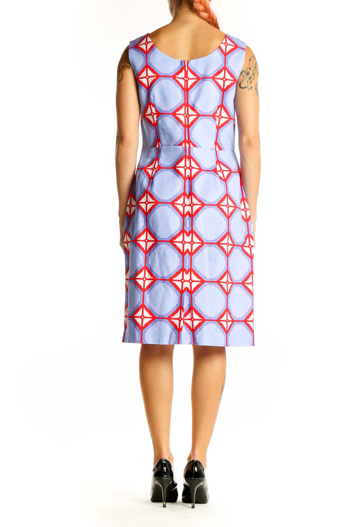 Side view of Elizabeth McKay blue and red geometric print sleeveless dress