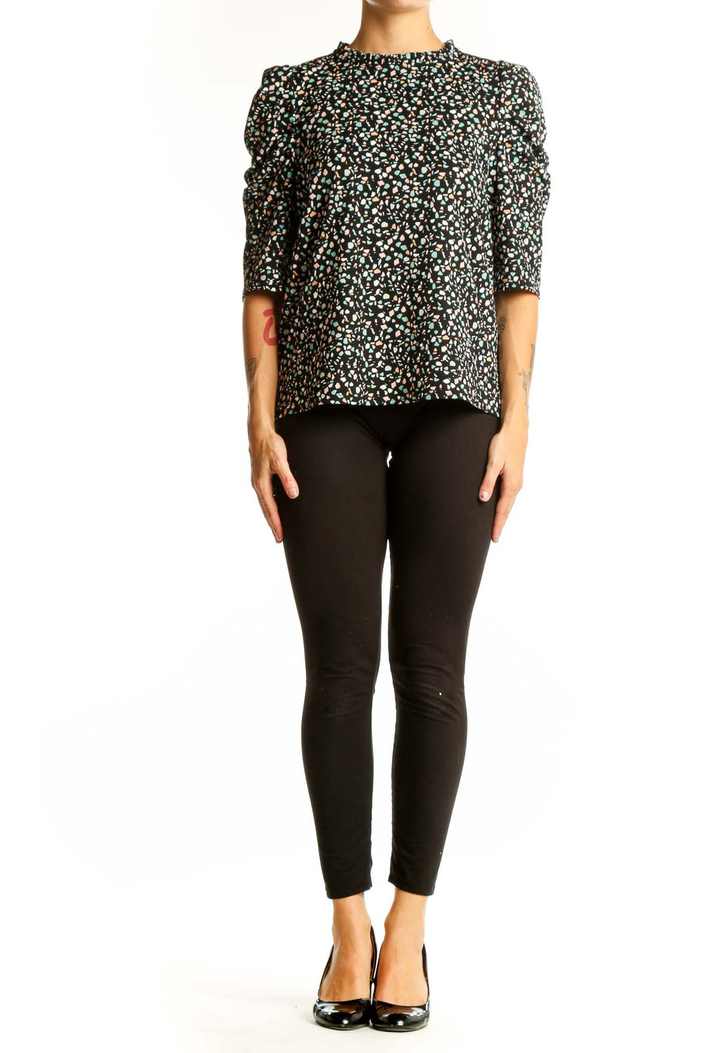 Front view of Melloday black floral print top with puff sleeves