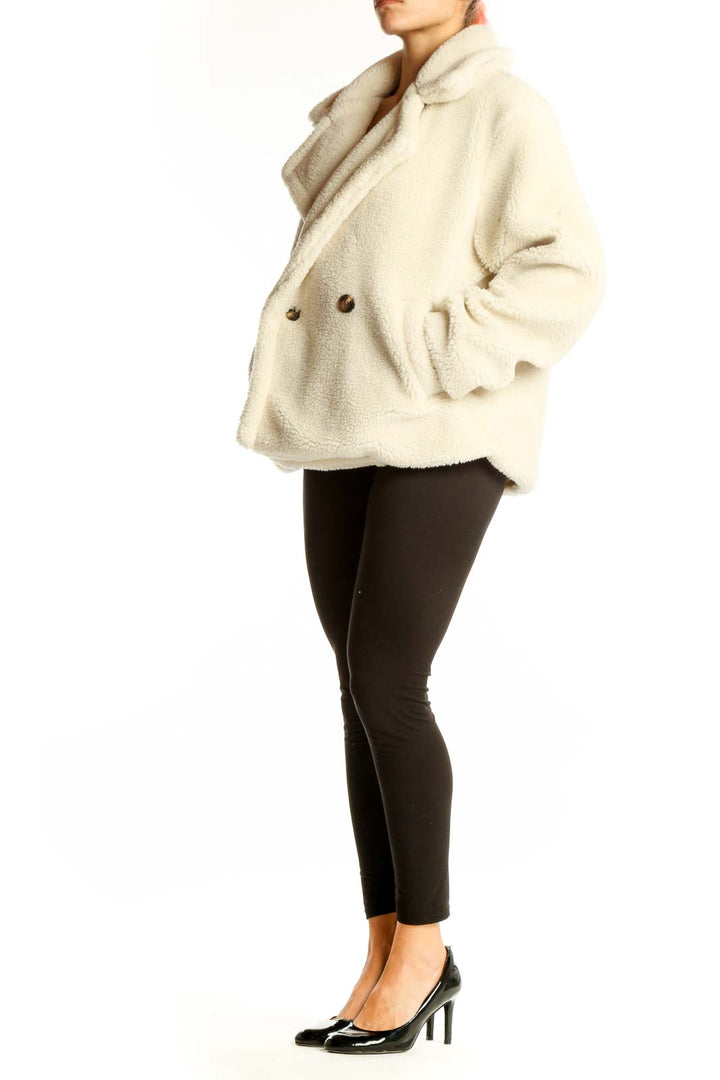 Front view of cream Gap double-breasted teddy coat
