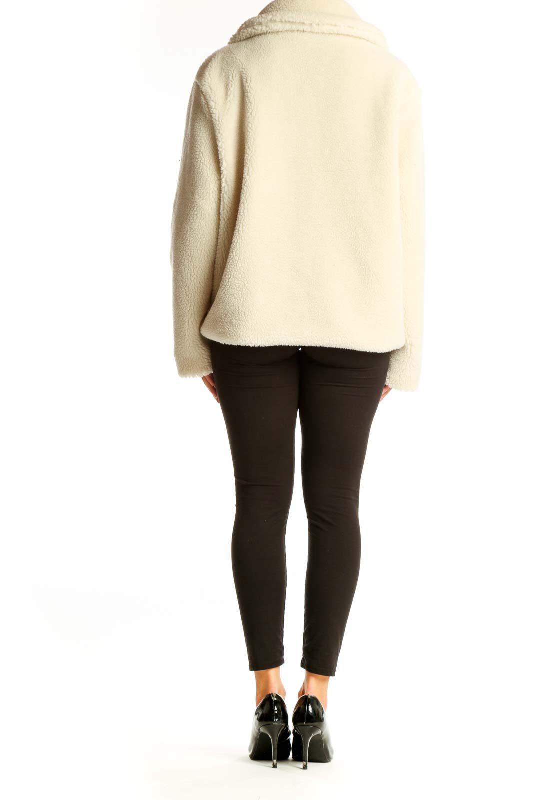 Side view of cream Gap double-breasted teddy coat on model