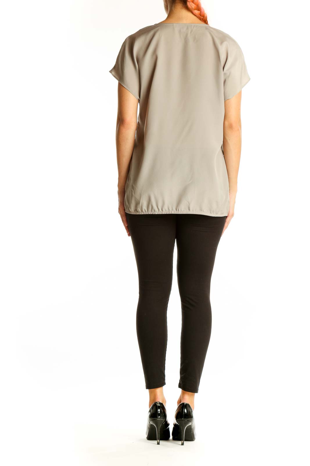 Side view of beige LOFT blouse showing relaxed fit and elasticated hem