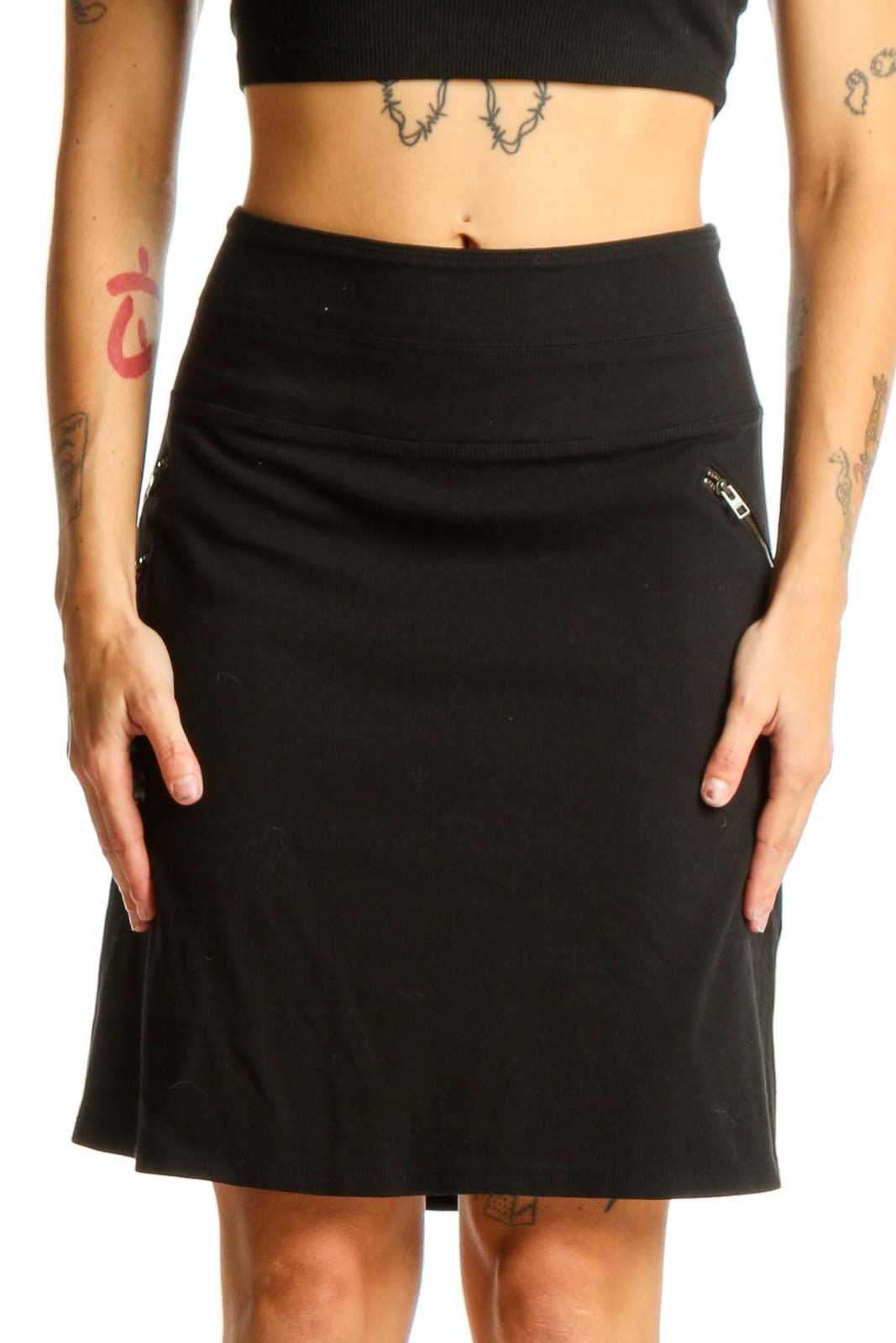 Front view of black Athleta A-line skirt with zipper pocket