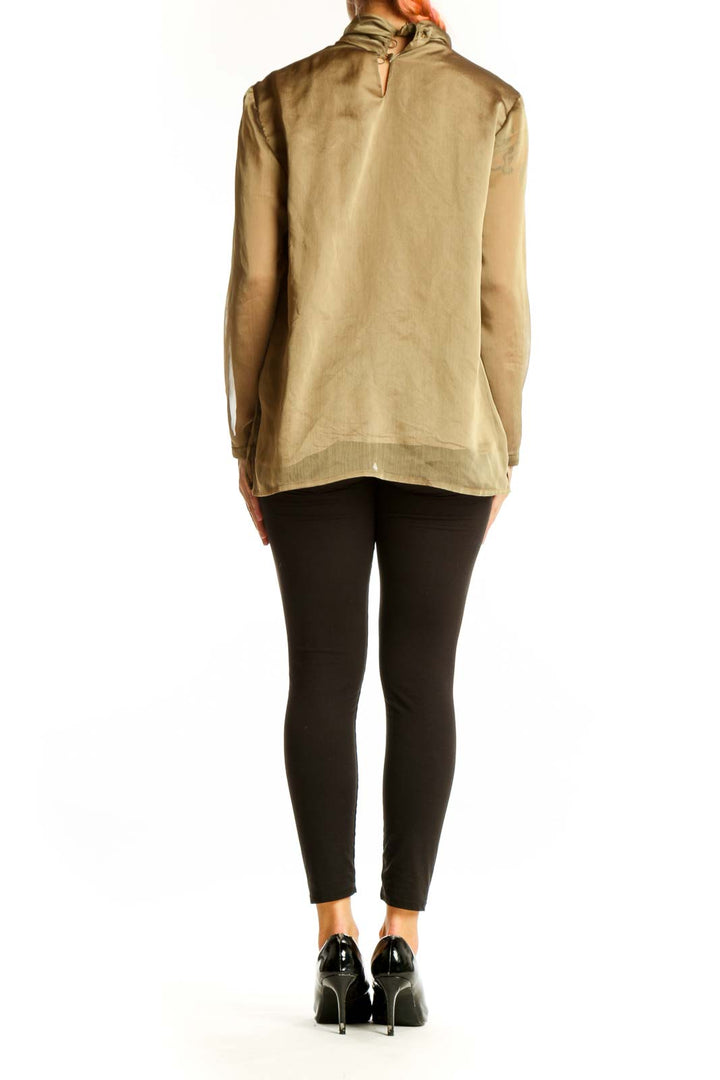 Side view of beige Casual Corner blouse with tie-neck detail