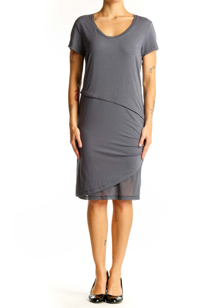 Front view of gray Halcyon dress with asymmetrical hem and ruching