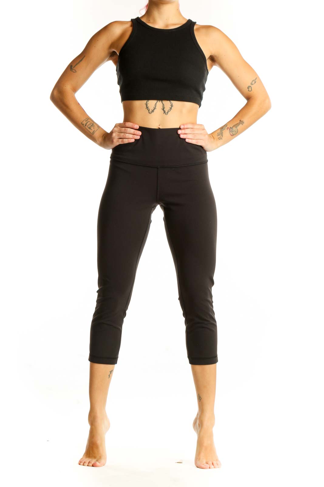 Front view of black Lululemon high-waisted capri leggings