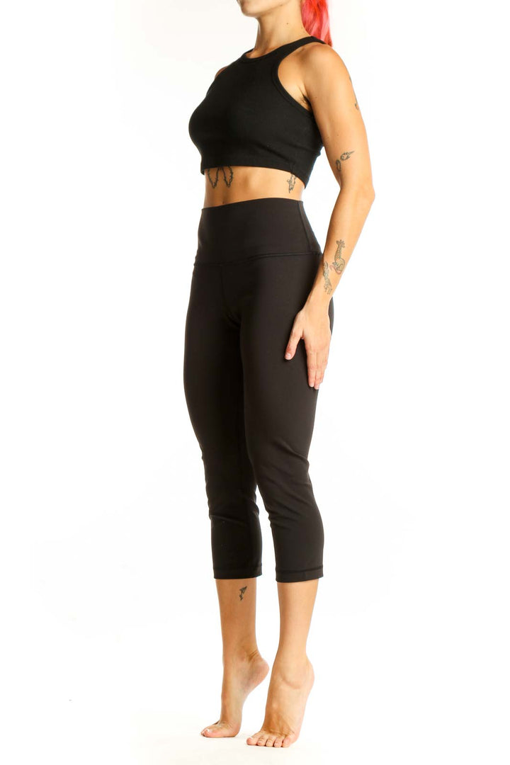 Front view of black Lululemon high-waisted capri leggings
