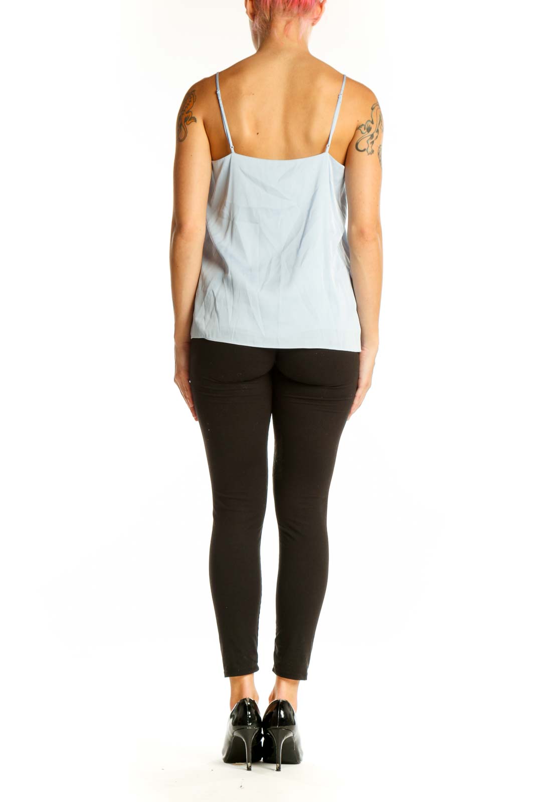 Side view of light blue silk camisole top from Quince on model