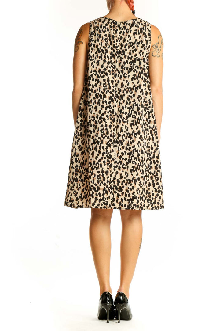 Side view of tan leopard print sleeveless shift dress by Halogen