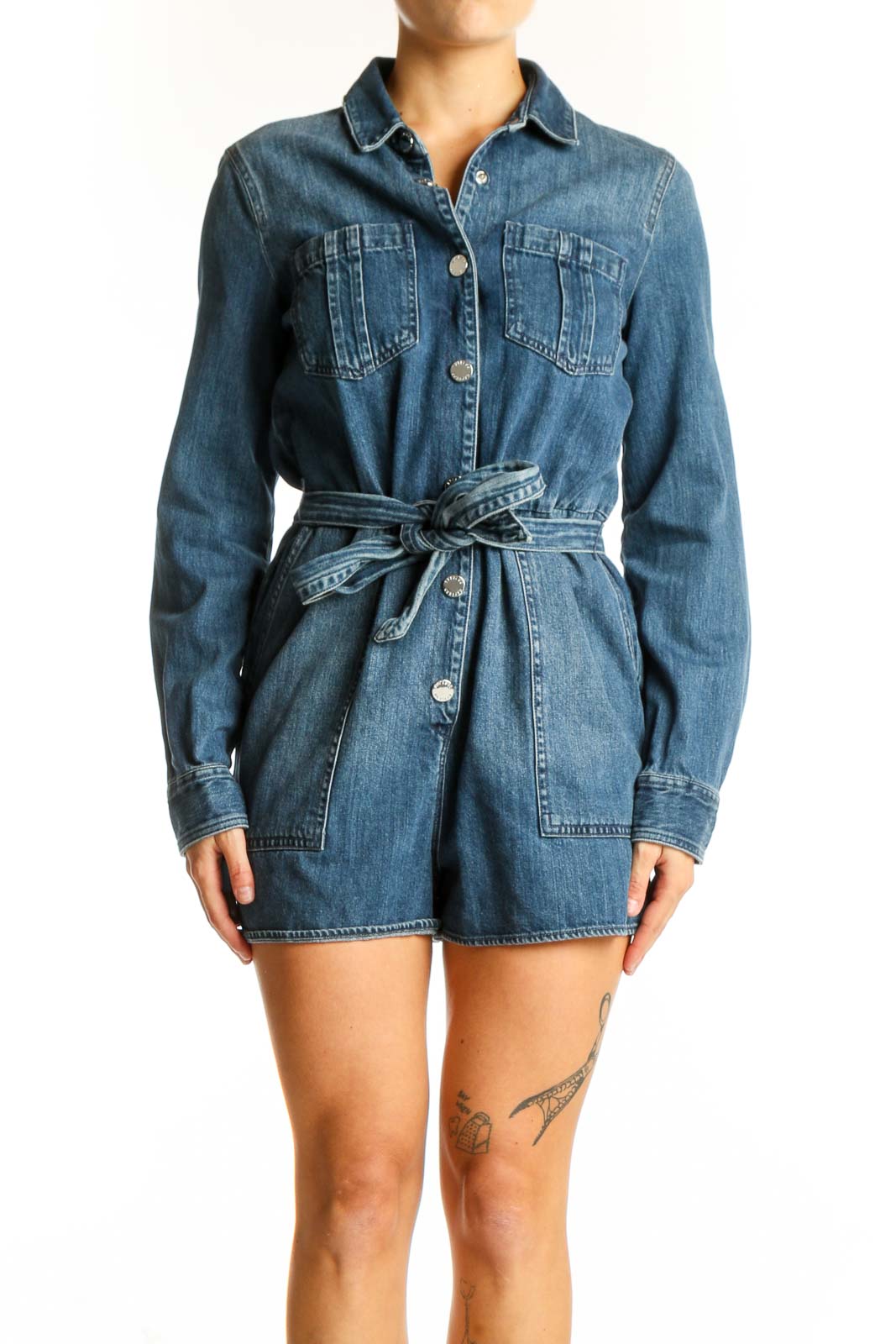 Front view of Express blue denim button-up romper with belt