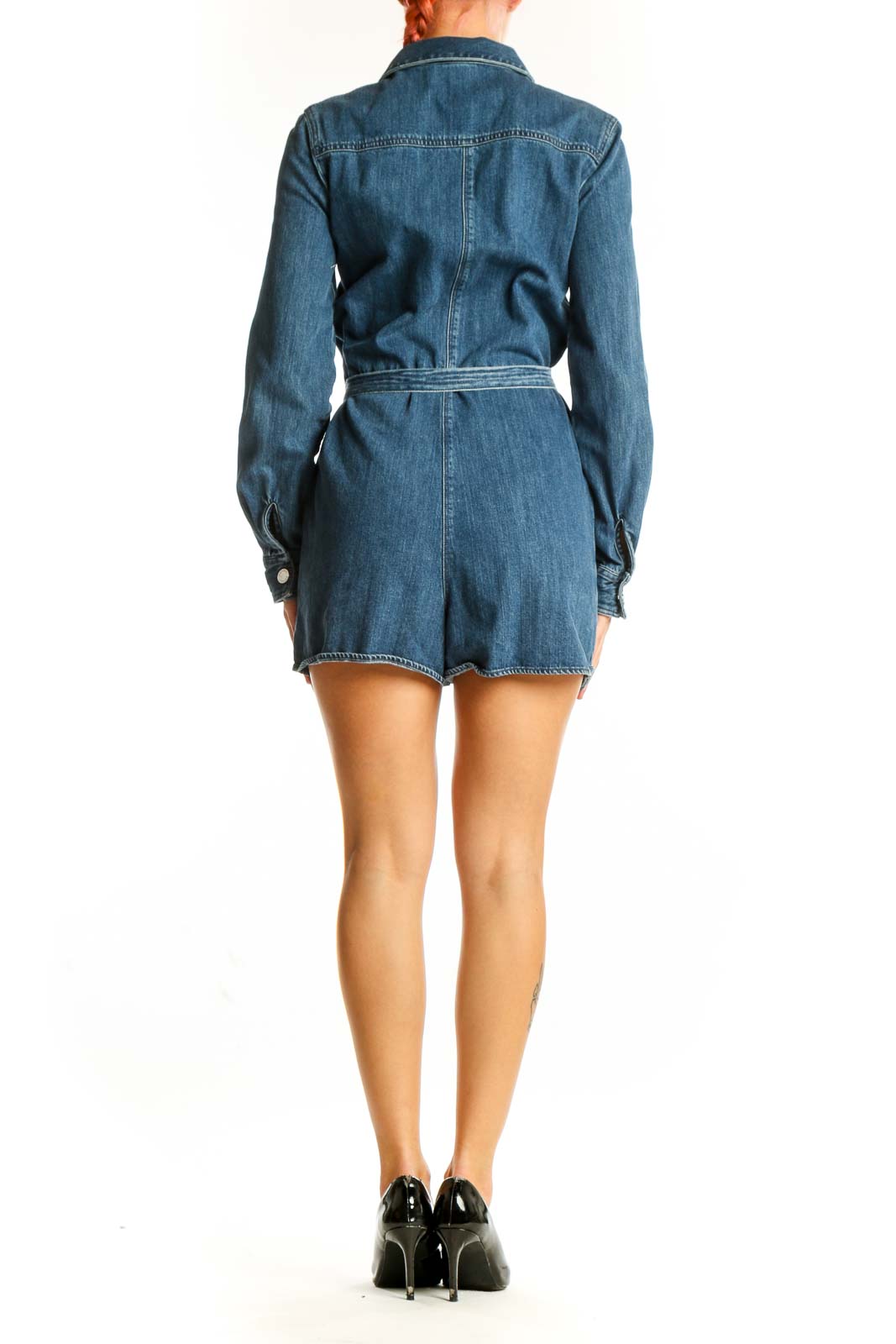 Side view of Express blue denim romper showing belted waist and pockets