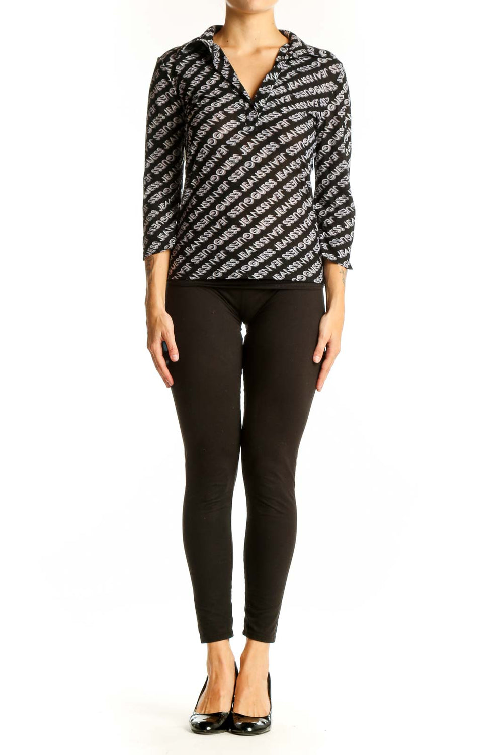 Front view of Guess black and white logo patterned wrap top