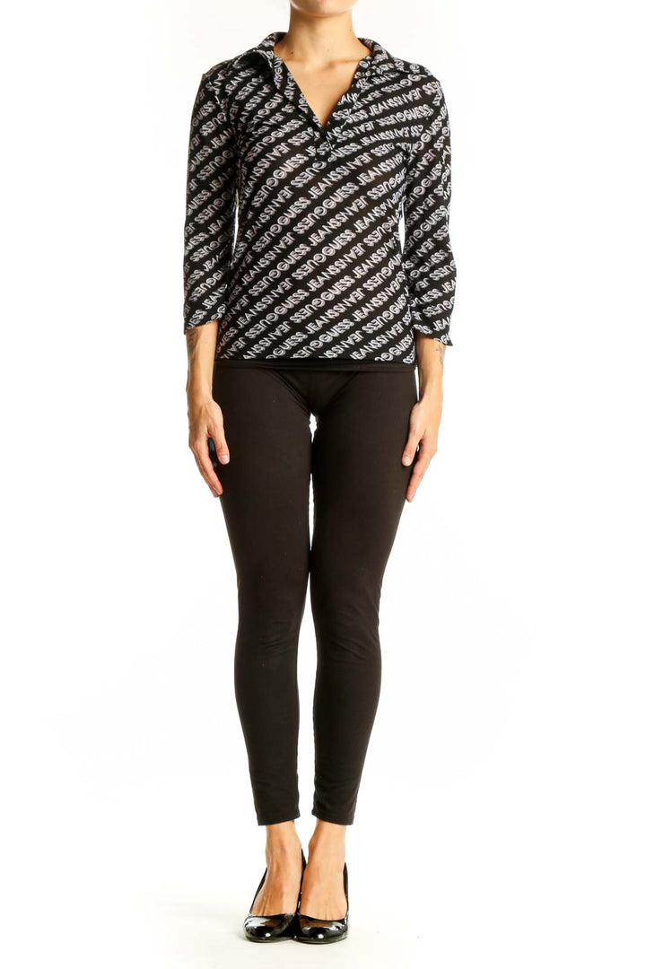 Front view of Guess black and white logo patterned wrap top